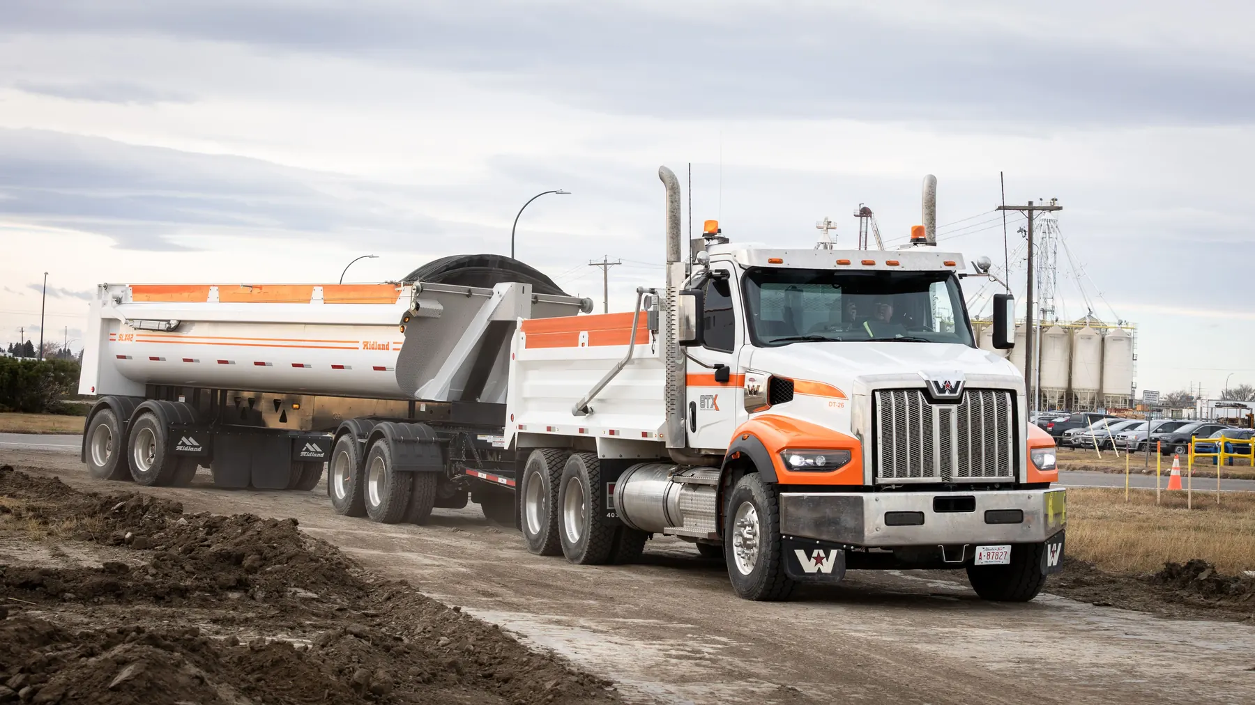 Subterrain gravel truck hauling material on an Alberta jobsite